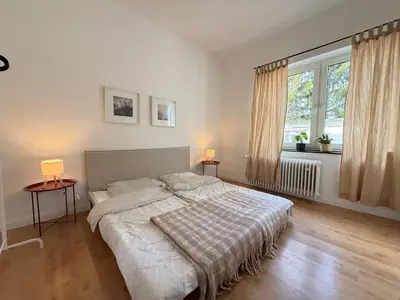 Ein Bett oder Betten in einem Zimmer der Unterkunft PURAVIDA Moderne, gemütliche 2-Zimmer-Wohlfühloase zentral in Oberhausen