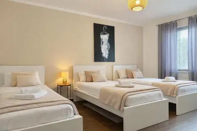 Ein Bett oder Betten in einem Zimmer der Unterkunft VAJAGIC 3 - Apartment 6 Pers, 2 Schlafzimmer, Messe, Uni Klinik