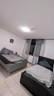 Ein Bett oder Betten in einem Zimmer der Unterkunft Alex Garden Apartments - EG - Terrasse - WLAN und Küche