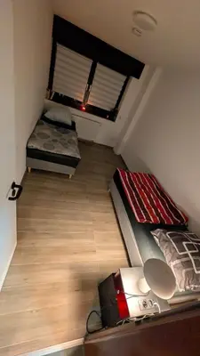 Ein Bett oder Betten in einem Zimmer der Unterkunft Alex Garden Apartments - EG - Terrasse - WLAN und Küche