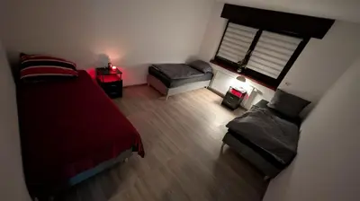 Ein Bett oder Betten in einem Zimmer der Unterkunft Alex Garden Apartments - EG - Terrasse - WLAN und Küche