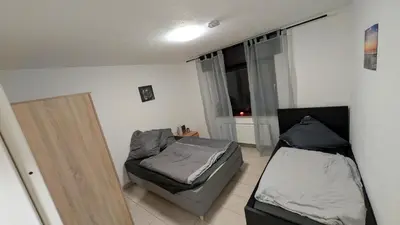 Ein Bett oder Betten in einem Zimmer der Unterkunft Alex Garden Apartments - EG - Terrasse - WLAN und Küche