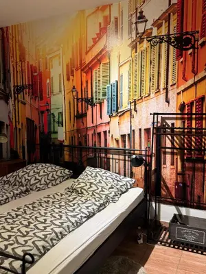 Ein Bett oder Betten in einem Zimmer der Unterkunft Themenzimmer Mediterrana Nähe Hauptbahnhof