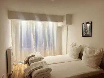 Ein Bett oder Betten in einem Zimmer der Unterkunft Emmas Apartments