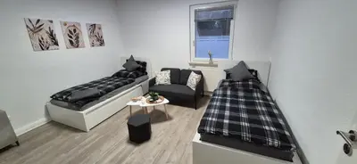 Ein Bett oder Betten in einem Zimmer der Unterkunft Gemütliche Ferienwohnung Monteurzimmer Schultendorf