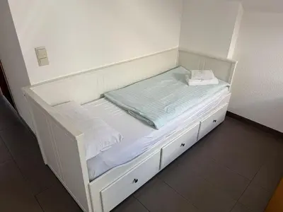 Ein Bett oder Betten in einem Zimmer der Unterkunft Wirtshaus zur Heimlichen Liebe