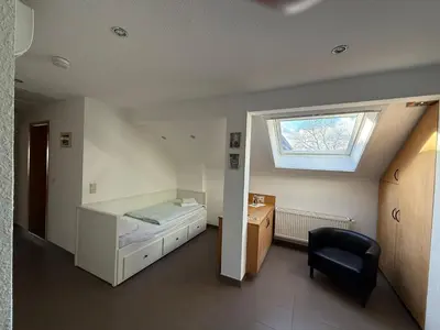 Ein Bett oder Betten in einem Zimmer der Unterkunft Wirtshaus zur Heimlichen Liebe