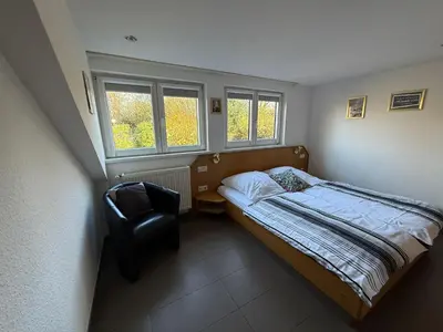 Ein Bett oder Betten in einem Zimmer der Unterkunft Wirtshaus zur Heimlichen Liebe