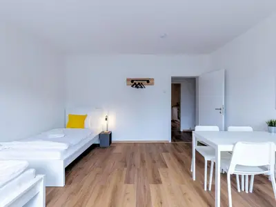 Ein Bett oder Betten in einem Zimmer der Unterkunft BudgetRoom 3 Schlafzimmer Workers Home