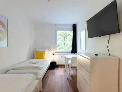 TV/Unterhaltungsangebot in der Unterkunft BudgetRoom 3 Schlafzimmer Workers Home