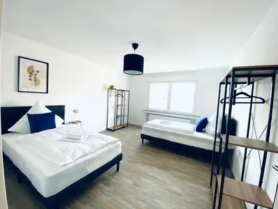 Ein Bett oder Betten in einem Zimmer der Unterkunft Komfortable XXL Teamsuite mit 1,20 Betten