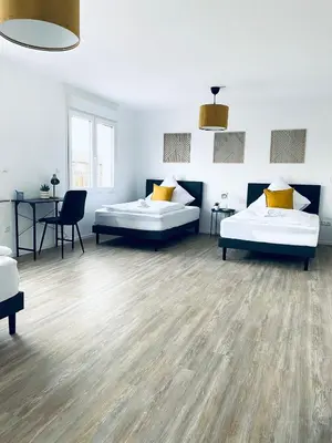 Ein Bett oder Betten in einem Zimmer der Unterkunft Komfortable XXL Teamsuite mit 1,20 Betten