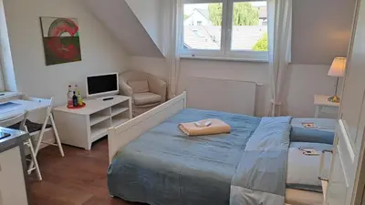 Ein Bett oder Betten in einem Zimmer der Unterkunft Bed and Breakfast Orange-Inn