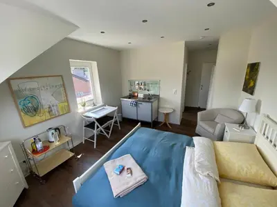 Ein Sitzbereich in der Unterkunft Bed and Breakfast Orange-Inn