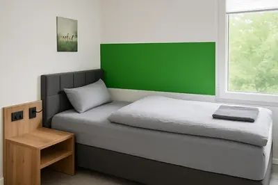Ein Bett oder Betten in einem Zimmer der Unterkunft Livemore24 - Apartment 2 in Herten 24-7 Check-In