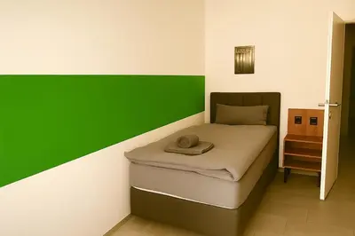 Ein Bett oder Betten in einem Zimmer der Unterkunft Livemore24 - Apartment 2 in Herten 24-7 Check-In