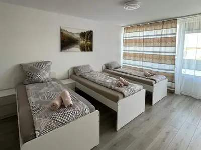 Ein Bett oder Betten in einem Zimmer der Unterkunft Modernes Apartment mit Balkon