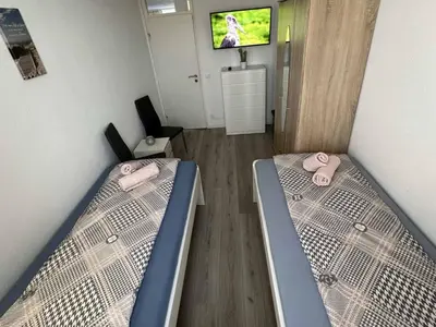 Ein Bett oder Betten in einem Zimmer der Unterkunft Modernes Apartment mit Balkon