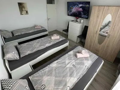 Ein Bett oder Betten in einem Zimmer der Unterkunft Modernes Apartment mit Balkon
