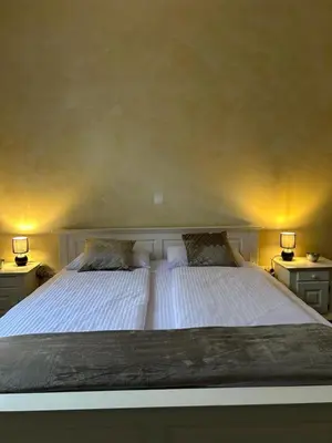 Ein Bett oder Betten in einem Zimmer der Unterkunft Sia Apartments Hotel