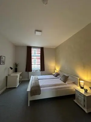 Ein Bett oder Betten in einem Zimmer der Unterkunft Sia Apartments Hotel