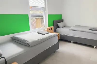 Ein Bett oder Betten in einem Zimmer der Unterkunft Livemore24 - Space in Herten 24-7 Check-in WIFI