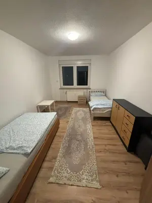 Ein Bett oder Betten in einem Zimmer der Unterkunft Speedstay oberhausen