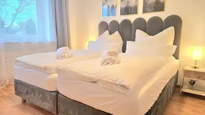Ein Bett oder Betten in einem Zimmer der Unterkunft 3 Zimmer I Küche I Balkon I WLAN I Parken I Seepark