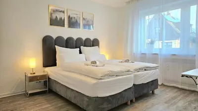 Ein Bett oder Betten in einem Zimmer der Unterkunft 3 Zimmer I Küche I Balkon I WLAN I Parken I Seepark