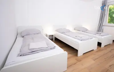 Ein Bett oder Betten in einem Zimmer der Unterkunft BEGE APARTMENTS LightHaus