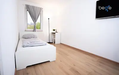Ein Bett oder Betten in einem Zimmer der Unterkunft BEGE APARTMENTS LightHaus