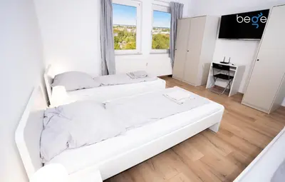 Ein Bett oder Betten in einem Zimmer der Unterkunft BEGE APARTMENTS LightHaus