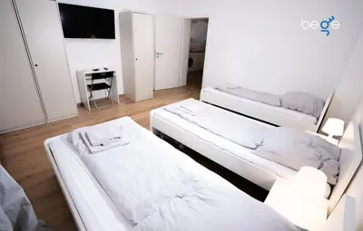 Ein Bett oder Betten in einem Zimmer der Unterkunft BEGE APARTMENTS LightHaus
