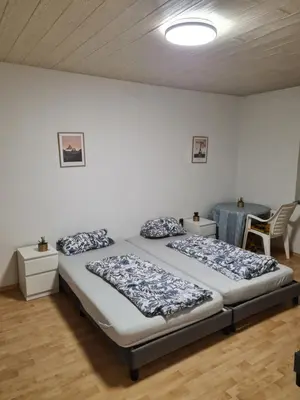 Ein Bett oder Betten in einem Zimmer der Unterkunft Guest-Apartment