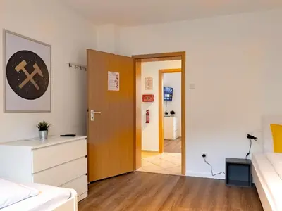 Ein Bett oder Betten in einem Zimmer der Unterkunft BudgetRoom 3 Bedroom Perfect for Teams