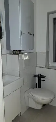 Ein Badezimmer in der Unterkunft Gästehaus Hagen 6 Betten, Parkplatz, Küche, WLAN Easybooking24