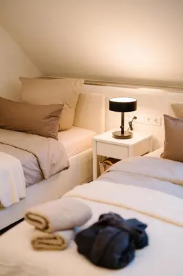Ein Bett oder Betten in einem Zimmer der Unterkunft saGo Airporthouse