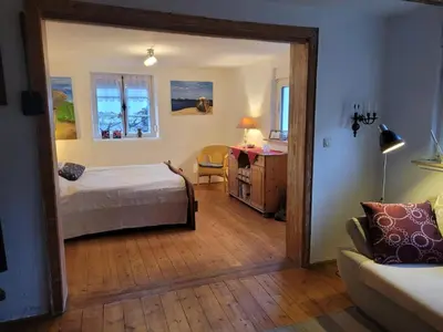 Ein Bett oder Betten in einem Zimmer der Unterkunft Fachwerkhaus mit Garten nah an Stadt und Natur