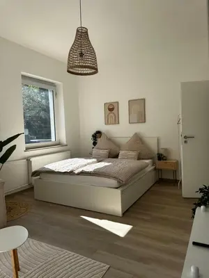 Ein Bett oder Betten in einem Zimmer der Unterkunft MD City Appartment