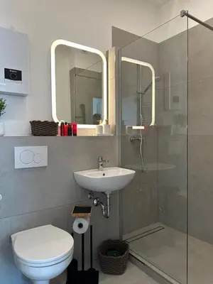 Ein Badezimmer in der Unterkunft MD City Appartment