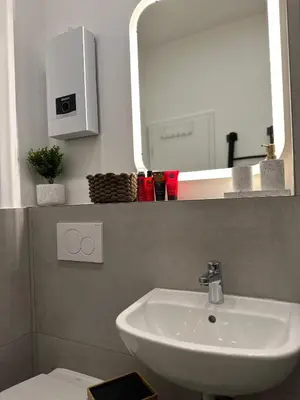 Ein Badezimmer in der Unterkunft MD City Appartment