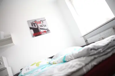 Ein Bett oder Betten in einem Zimmer der Unterkunft Bermuda Apartment