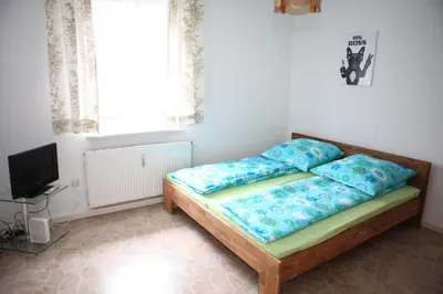 Ein Bett oder Betten in einem Zimmer der Unterkunft Bermuda Apartment