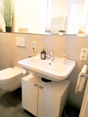 Ein Badezimmer in der Unterkunft Modernes City-Appartement mit separatem Schlafzimmer