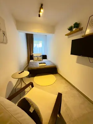 Ein Bett oder Betten in einem Zimmer der Unterkunft Business Apartment City 5 Betten & Parkplatz