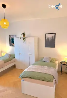 Ein Bett oder Betten in einem Zimmer der Unterkunft BEGE APARTMENTS City Residence