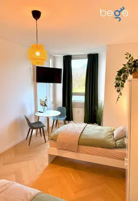 Ein Bett oder Betten in einem Zimmer der Unterkunft BEGE APARTMENTS City Residence