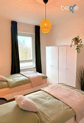 Ein Bett oder Betten in einem Zimmer der Unterkunft BEGE APARTMENTS City Residence