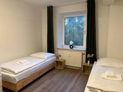 Ein Bett oder Betten in einem Zimmer der Unterkunft T&K Apartments - Gelsenkirchen - 2 Schlafzimmer Wohnungen - Vollausgestattet
