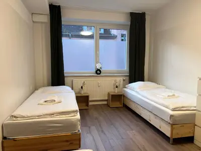 Ein Bett oder Betten in einem Zimmer der Unterkunft T&K Apartments - Gelsenkirchen - 2 Schlafzimmer Wohnungen - Vollausgestattet